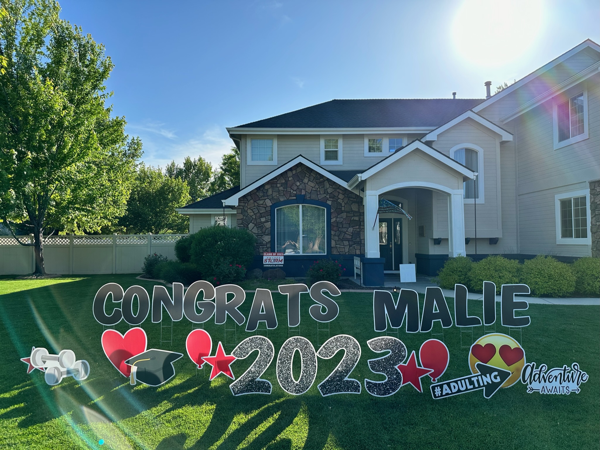 Congratulations Malie graduation yard card display with colorful letters and graduation art in Boise Idaho